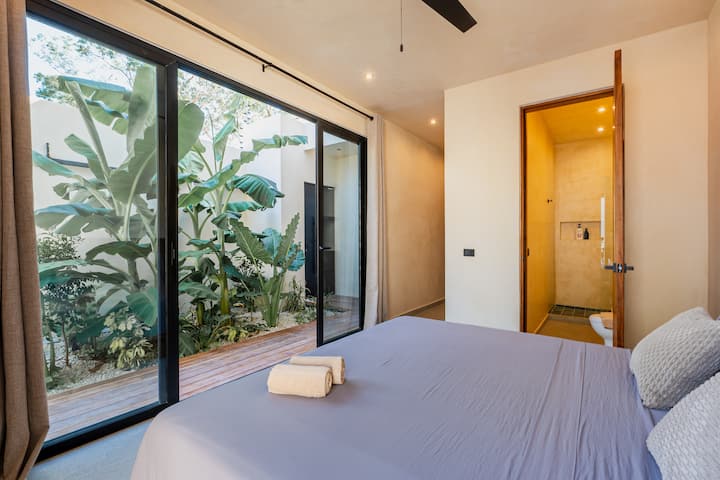 Casa Dalida pool deck with sunbeds and integrated living area